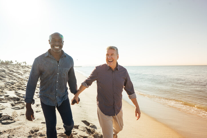 Two men on beach representing Planned Giving Ignite Faith Niagara